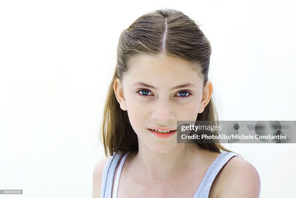 Preteen girl smiling at camera, portrait