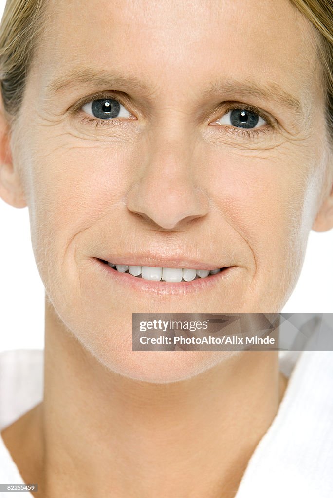 Mature woman smiling at camera, portrait