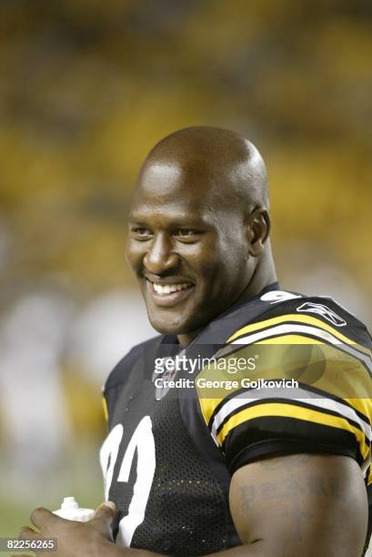 Linebacker James Harrison of the Pittsburgh Steelers smiles as he looks on from the sideline during a preseason game against the Philadelphia Eagles...
