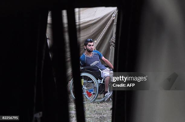 Refugee from South Ossetia is pictured in a refugge camp visited by French Foreign Minister Bernard Kouchner on August 11 near the village of Alagir,...