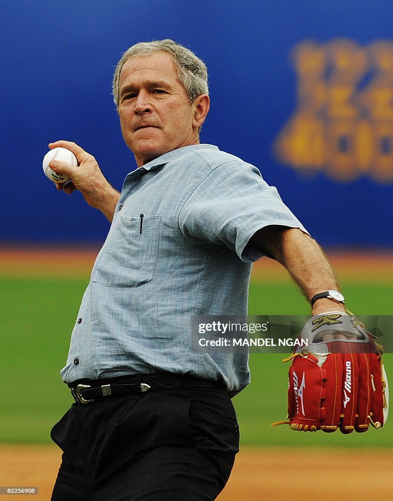 Bush Baseball US President George W. Bush throws a pitch ahead of a practice 2008 ...
