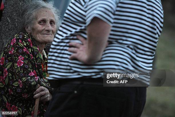 An elderly woman from South Ossetia looks on in a refugee camp visited by French Foreign Minister Bernard Kouchner on August 11 near the village of...