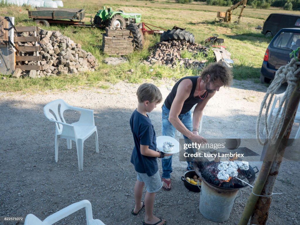 Father preparing food with his son