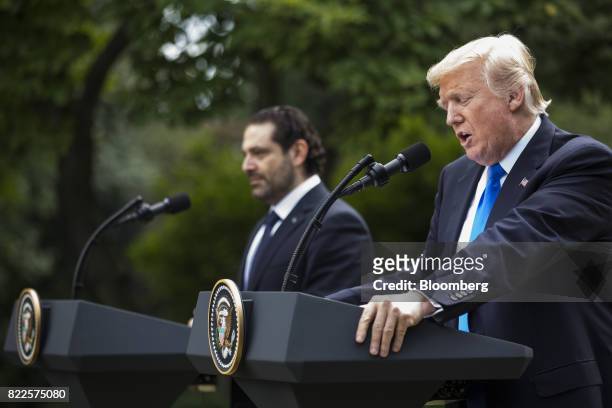 President Donald Trump, right, speaks as Saad Hariri, Lebanon's prime minister, listens during a joint press conference in the Rose Garden of the...