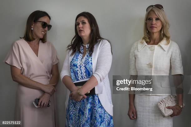 Sarah Huckabee Sanders, White House press secretary-designate, center, and Kellyanne Conway, senior advisor to U.S. President Donald Trump, right,...