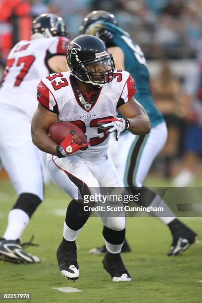 Michael Turner of the Atlanta Falcons carries the ball against the Jacksonville Jaguars at Jacksonville Municipal Stadium on August 9, 2008 in...