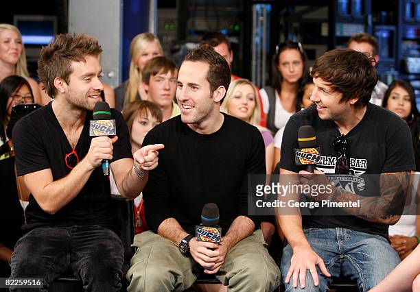 Musicians Sebastien Lefebvre, Chuck Comeau, and Pierre Bouvier of Simple Plan visit MuchOnDemand at MuchMusic HQ on August 11, 2008 in Toronto,...