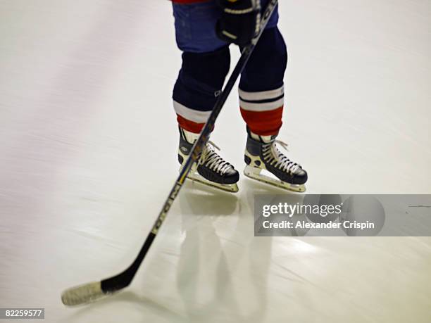 the feet of a ice hockey player. - ice hockey stick stock pictures, royalty-free photos & images