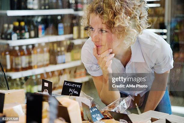 a woman buying cheese sweden. - deli counter stock pictures, royalty-free photos & images