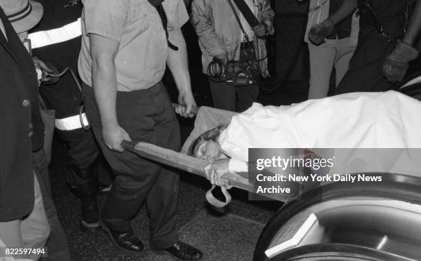 New York Airway helicopter, poised for take-off from the roof of the 59-story Pan Am Building, suddenly toppled over yesterday and its rotor blades...