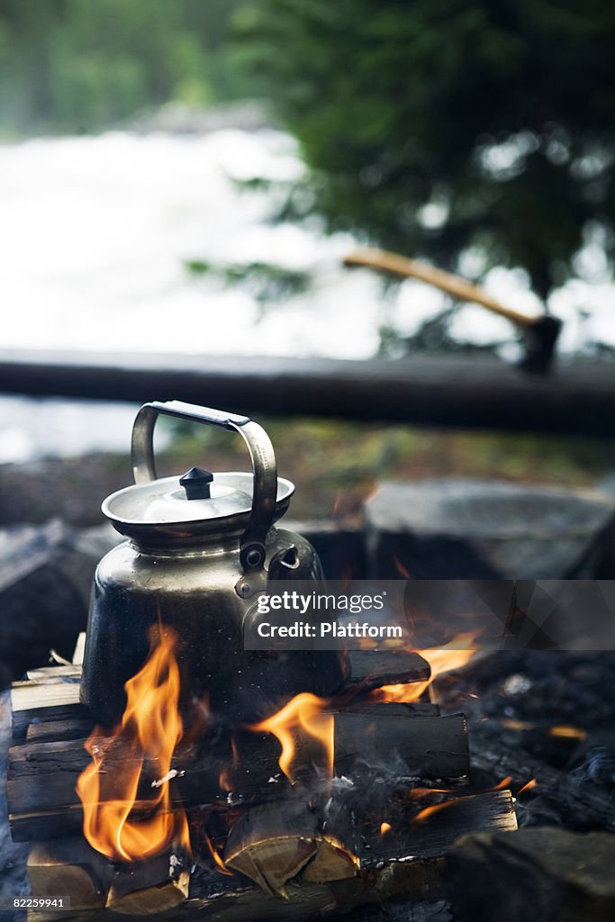 Making coffee over a camp fire Sweden.