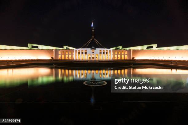 daytime view of parliament house, canberra, australia - canberra parliament house australia stock-fotos und bilder