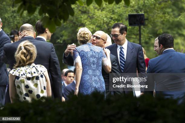 McMaster, national security advisor, center right, hugs Ivanka Trump, assistant to U.S. President Donald Trump, center left, before the start of a...