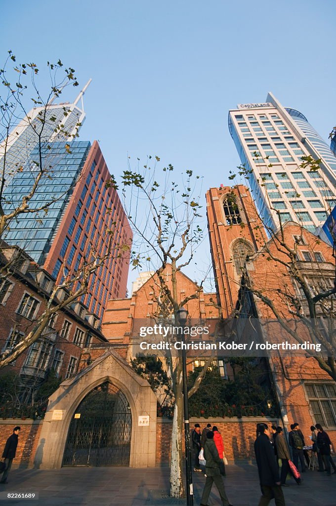 A Christian church among modern skyscrapers on Renmin Square, Puxi area, Shanghai, China, Asia