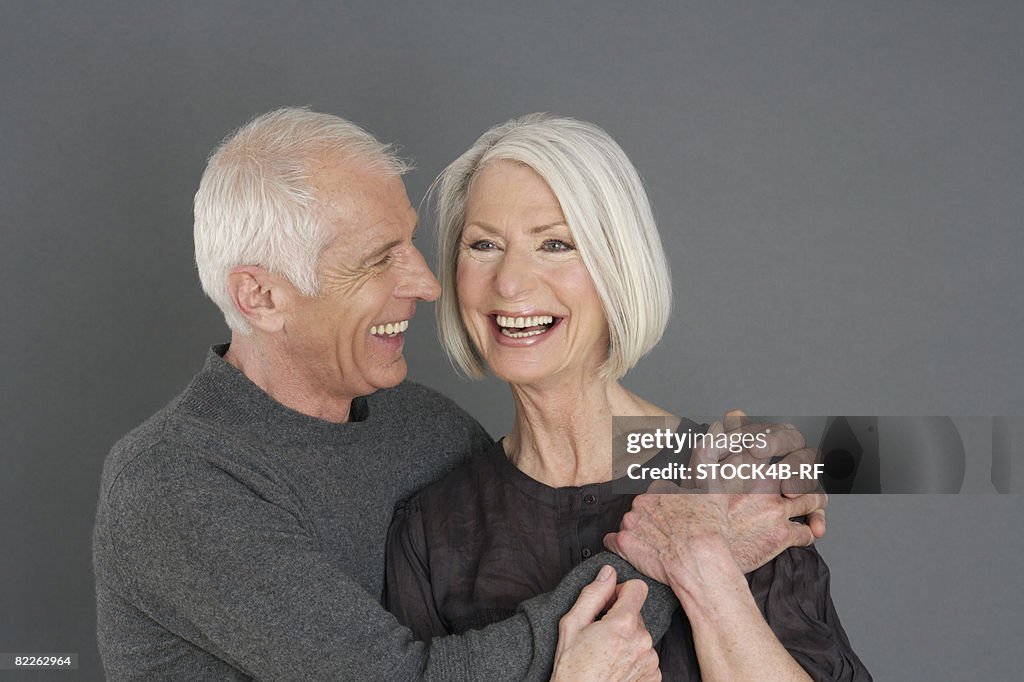 Laughing senior couple