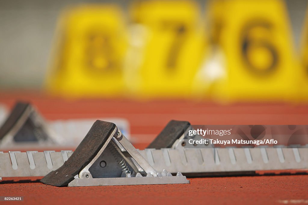 Track and field starting blocks at starting line
