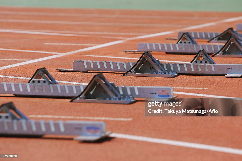 Track and field starting blocks at starting line