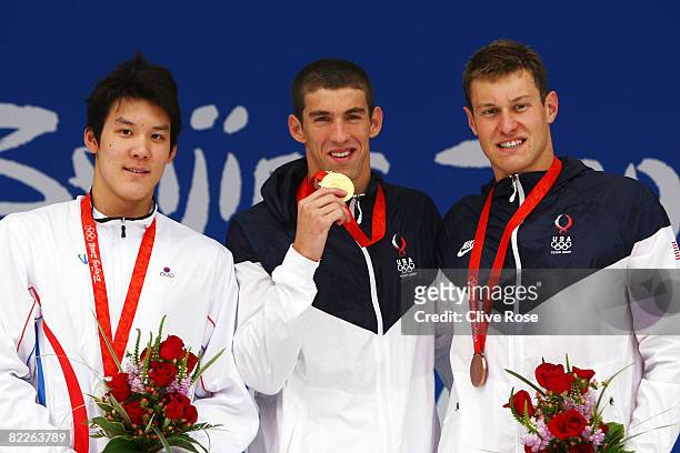 Silver medalist Park Taehwan of South Korea, gold medalist Michael Phelps of the United States and bronze medalist Peter Vanderkaay of the United...