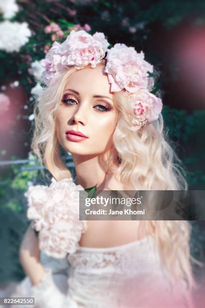 beautiful woman with peonies - bridal make up stock pictures, royalty-free photos & images