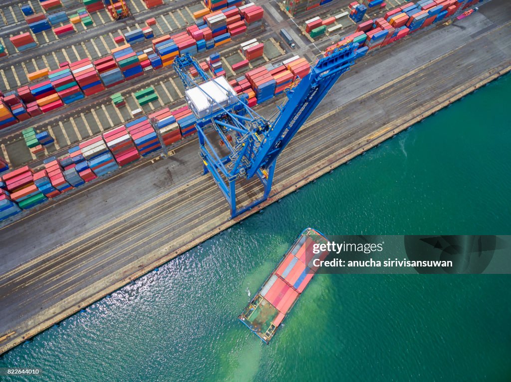 Container cargo Ship parked Harbor cranes .