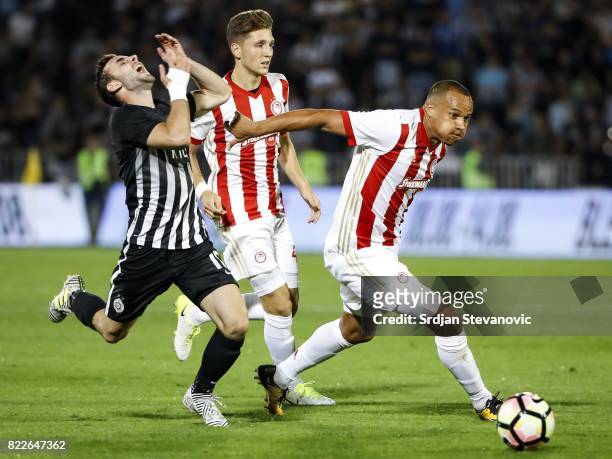 Marko Jankovic of Partizan is challenged by Vadis Odjidja of Olympiacos during the UEFA Champions League Qualifying match between FC Partizan and...