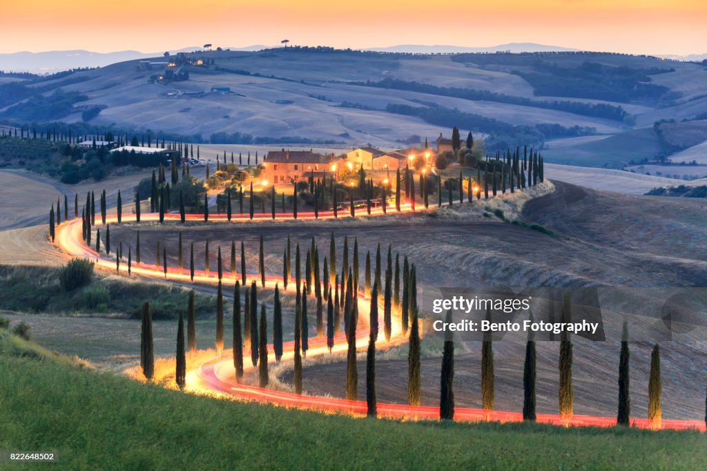 Car lighting in Zigzag road in Tuscany, Italy