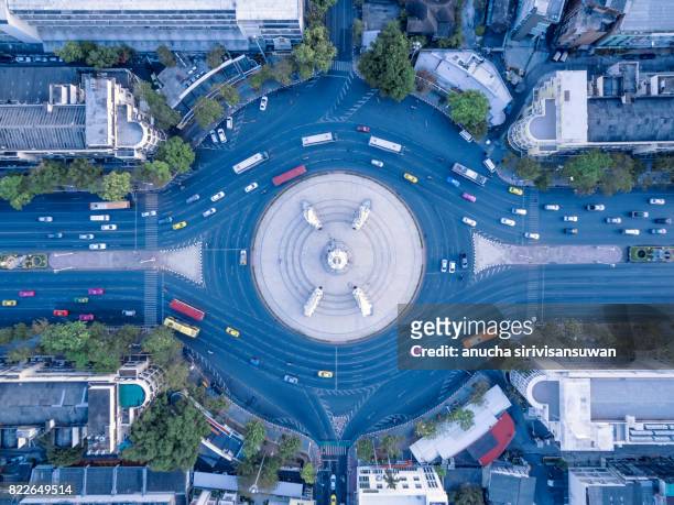 aerial view street roundabout with car at beautiful at morning , top view , democracy monument , bangkok , thailand . - car aerial view stock pictures, royalty-free photos & images