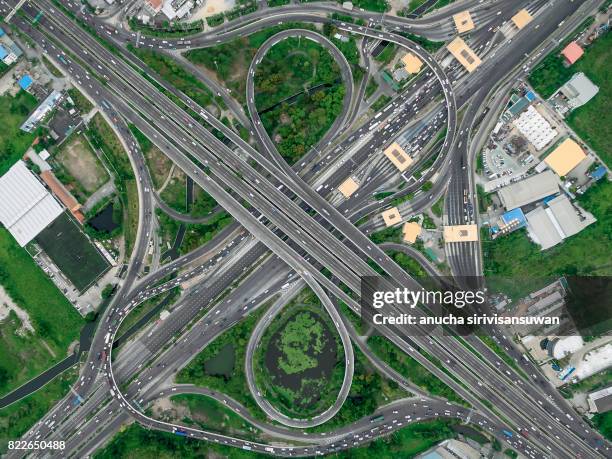road interchange highway traffic beautiful , bird eye view in bangkok , top view , bangkok , thailand . - road reflector stock pictures, royalty-free photos & images