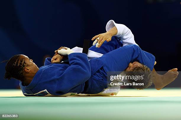 Lucie Decosse of France competes against Urska Zolnir of Slovenia in the women's half middleweight 63kg preliminary event at the University of...