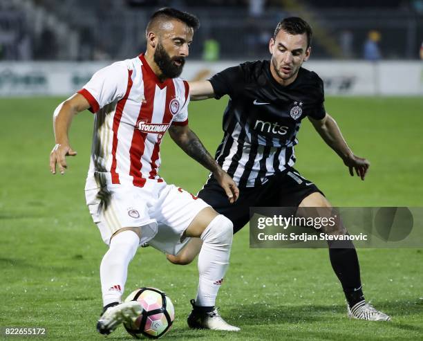 Manolis Siopis of Olympiacos in action against Marko Jankovic of Partizan during the UEFA Champions League Qualifying match between FC Partizan and...