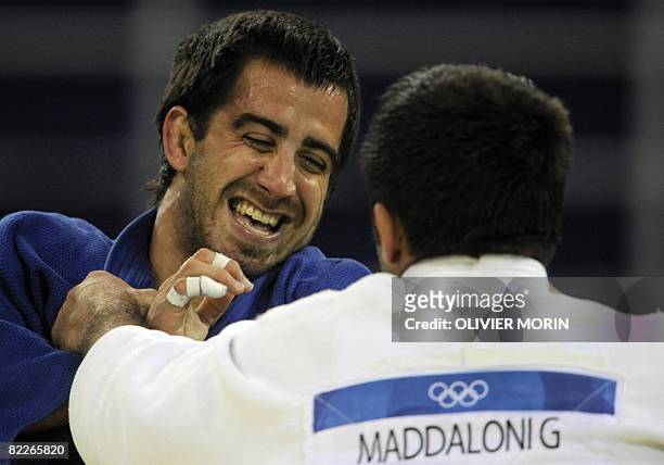 Italy's Giuseppe Maddaloni and Puerto Rico's Abderraman Brenes la Roche compete during their men's -81kg judo match of the 2008 Beijing Olympic Games...