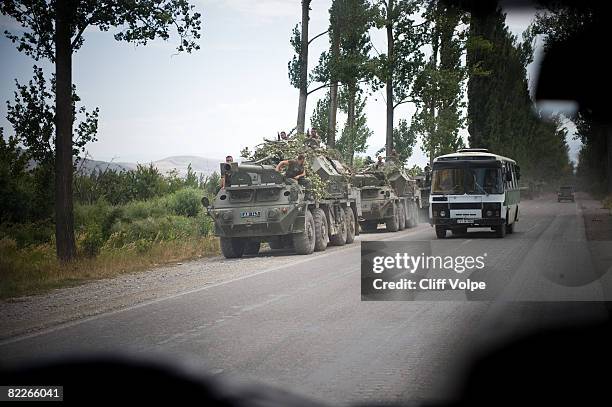 Facing north, Georgian soldiers and military vehicles wait along the road between Gori and South Ossetia August 11, 2008 in Gori, Georgia. Russian...