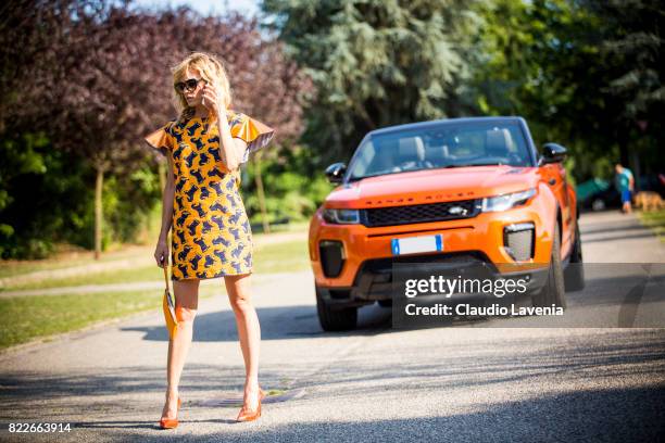 Justine Mattera wearing a Mauro Gasperi orange dress, Alef orange bag, Dsquared2 sunglasses and Giovanni Fabiani shoes, is seen ahead of her Range...