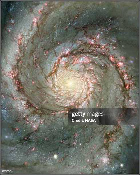 New pictures from the Hubble telescope, made available April 5, 2001 are giving astronomers a detailed view of the Whirlpool galaxy's spiral arms and...