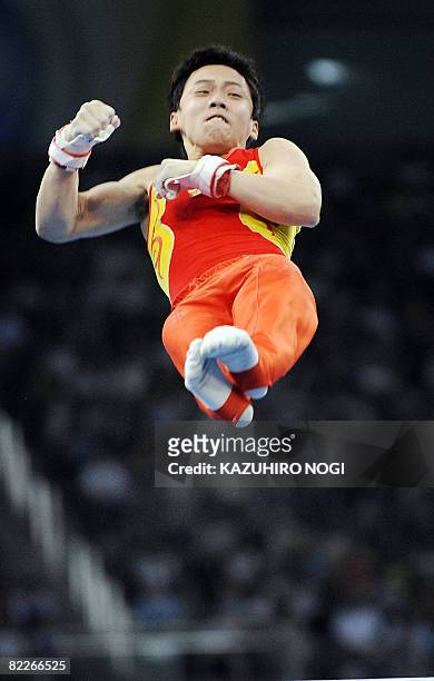 China's Kai Zou competes on the horizontal bars during the men's team final of the artistic gymnastics event of the Beijing 2008 Olympic Games in...