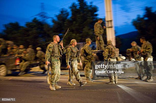 Georgian troops rush to evacuate from Gori along the highway towards Tbilisi on August 11, 2008 near Gori, Georgia. Georgian troops are withdrawing...