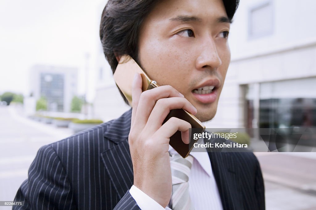 A business man talking on cell phone