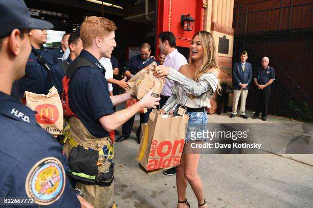 McDonalds CEO Steve Easterbrook and Chrissy Teigen share McDelivery with the Hoboken Fire Department on July 25, 2017 in Hoboken City.
