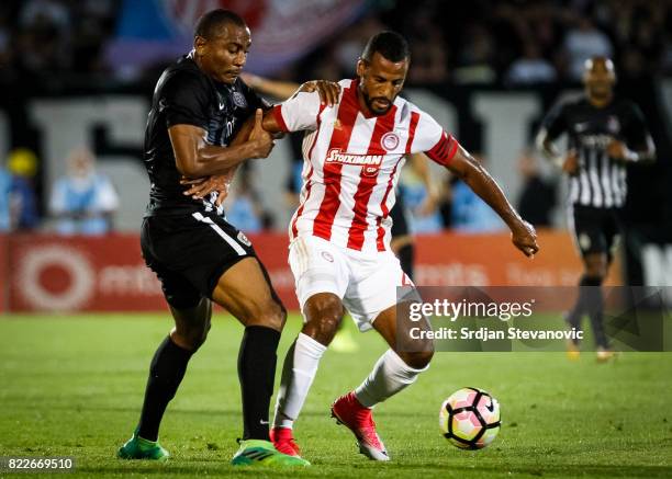 Alaixys Romao of Olympiacos in action against Leandre Tawamba of Partizan during the UEFA Champions League Qualifying match between FC Partizan and...