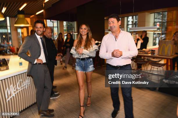 Chrissy Teigen and McDonalds CEO Steve Easterbrook visit McDonald's to celebrate McDelivery on July 25, 2017 in New York City.