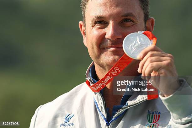 Francesco D'Aniello of Italy poses with his silver medal during the medal ceremony for the men's double trap held at the Beijing Shooting Range Hall...