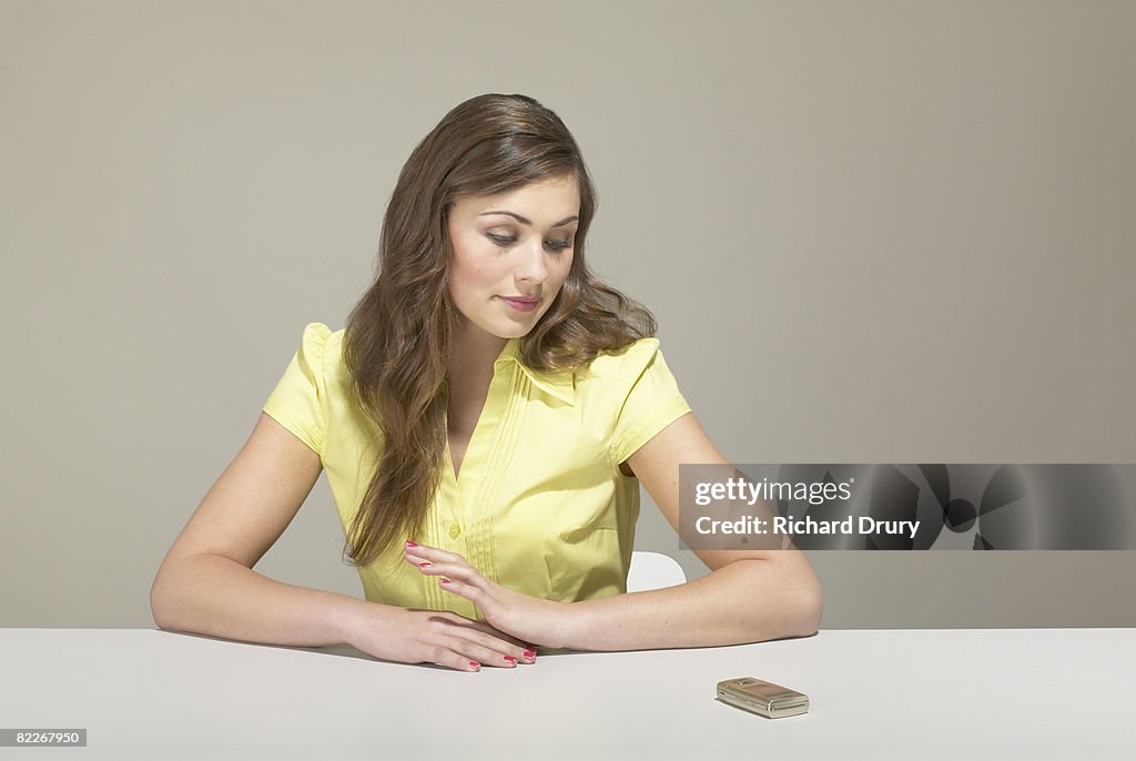 Young businesswoman looking at mobile phone