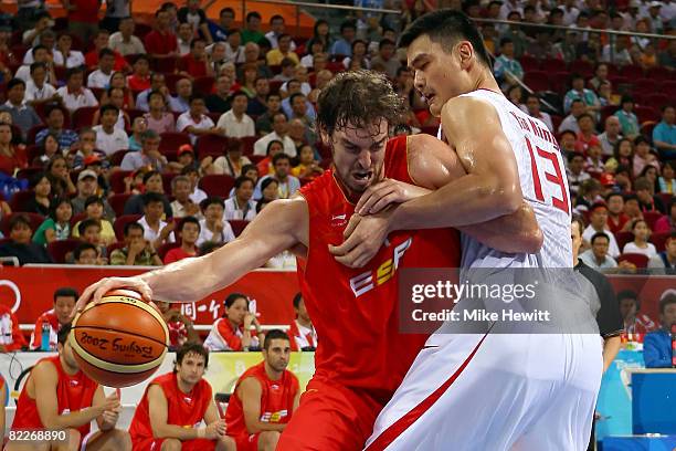 Pau Gasol of Spain drives to the basket on Yao Ming of China in their preliminary round basketball game held at the Beijing Olympic Basketball...