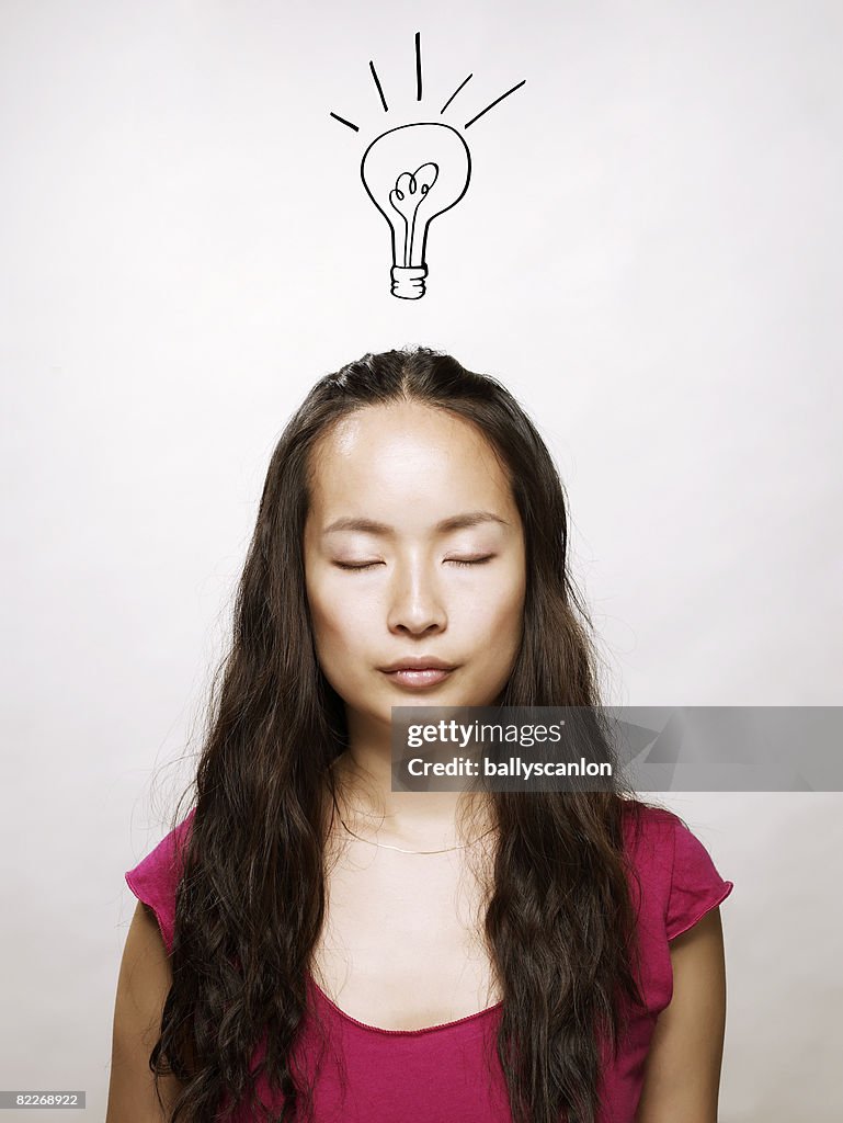 Young asian woman with eyes closed