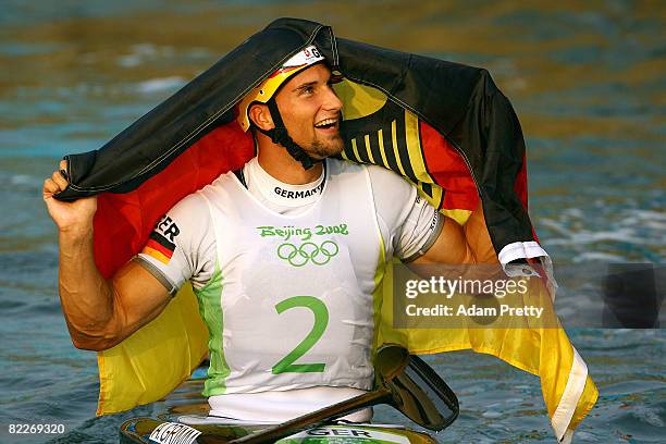 Alexander Grimm of Germany celebrates after winning the gold medal the Kayak Men's Final held at the Shunyi Olympic Rowing-Canoeing Park on Day 4 of...