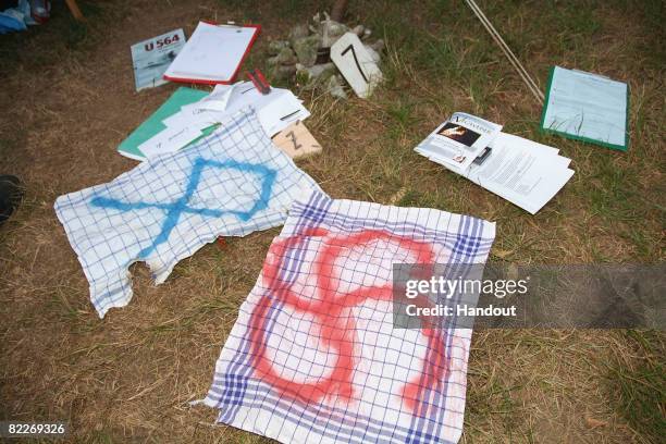 Police handout photo shows towels covered with a swastika and the Runic letter 'O' at a children's summer camp on a private property near the hamlet...
