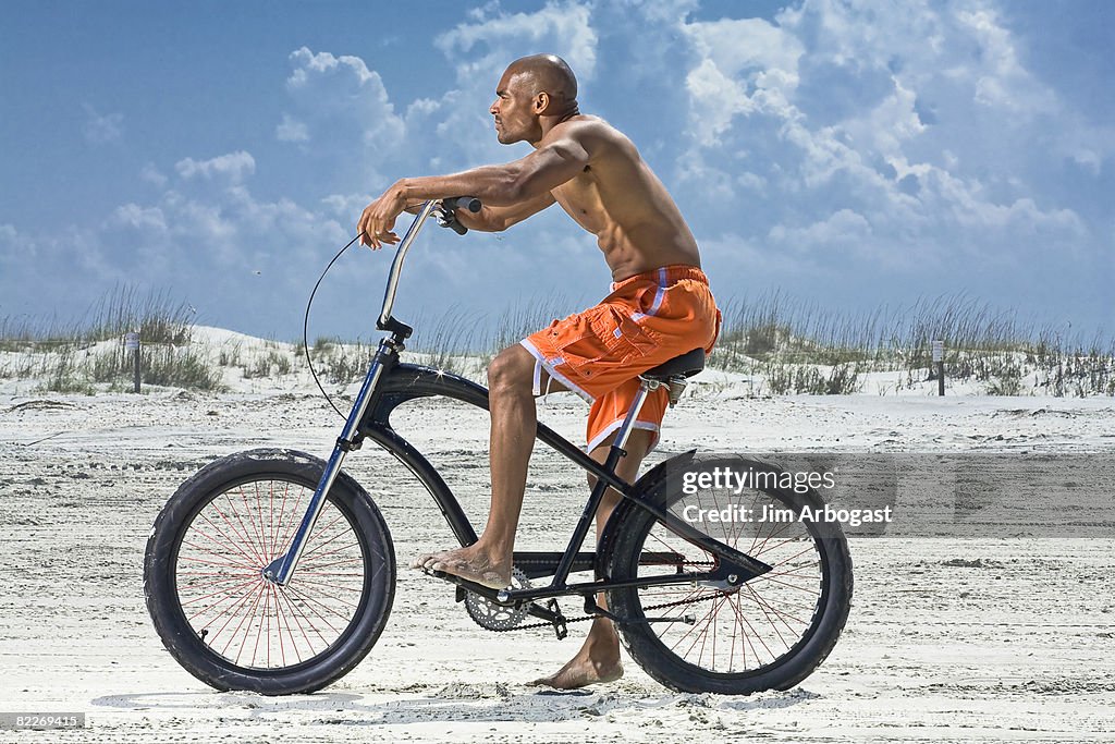 Man takes a bike ride.