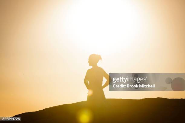 Jogger takes a break to enjoy the early morning sun at Bondi on July 26, 2017 in Sydney, Australia. Sydney is on track to have its warmest winter...