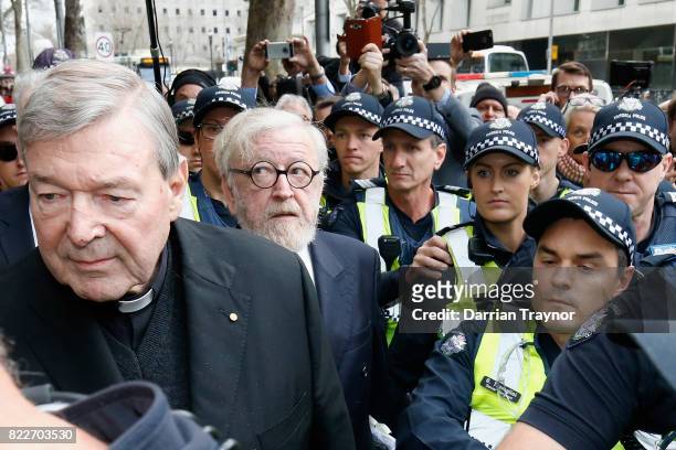 Cardinal George Pell leaves the Melbourne Magistrates Court with a heavy police guard in Melbourne on July 26, 2017 in Melbourne, Australia. Cardinal...