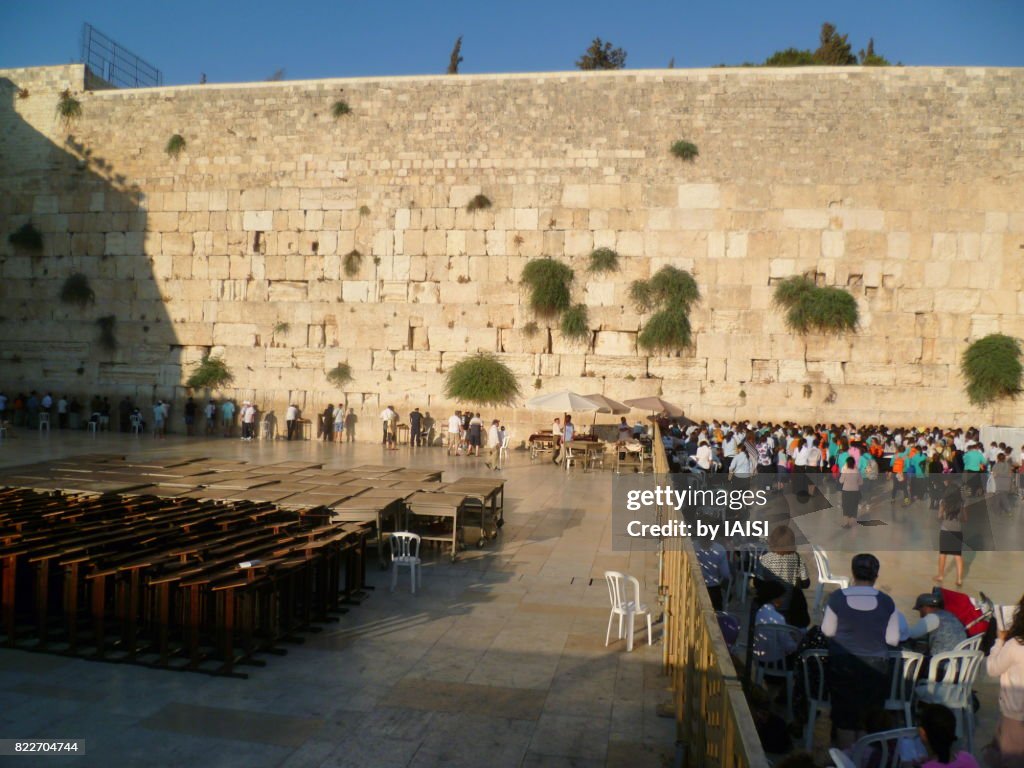 Jerusalem, the Western Wall, dusk at the mens' side on the left, the womens' side on the right